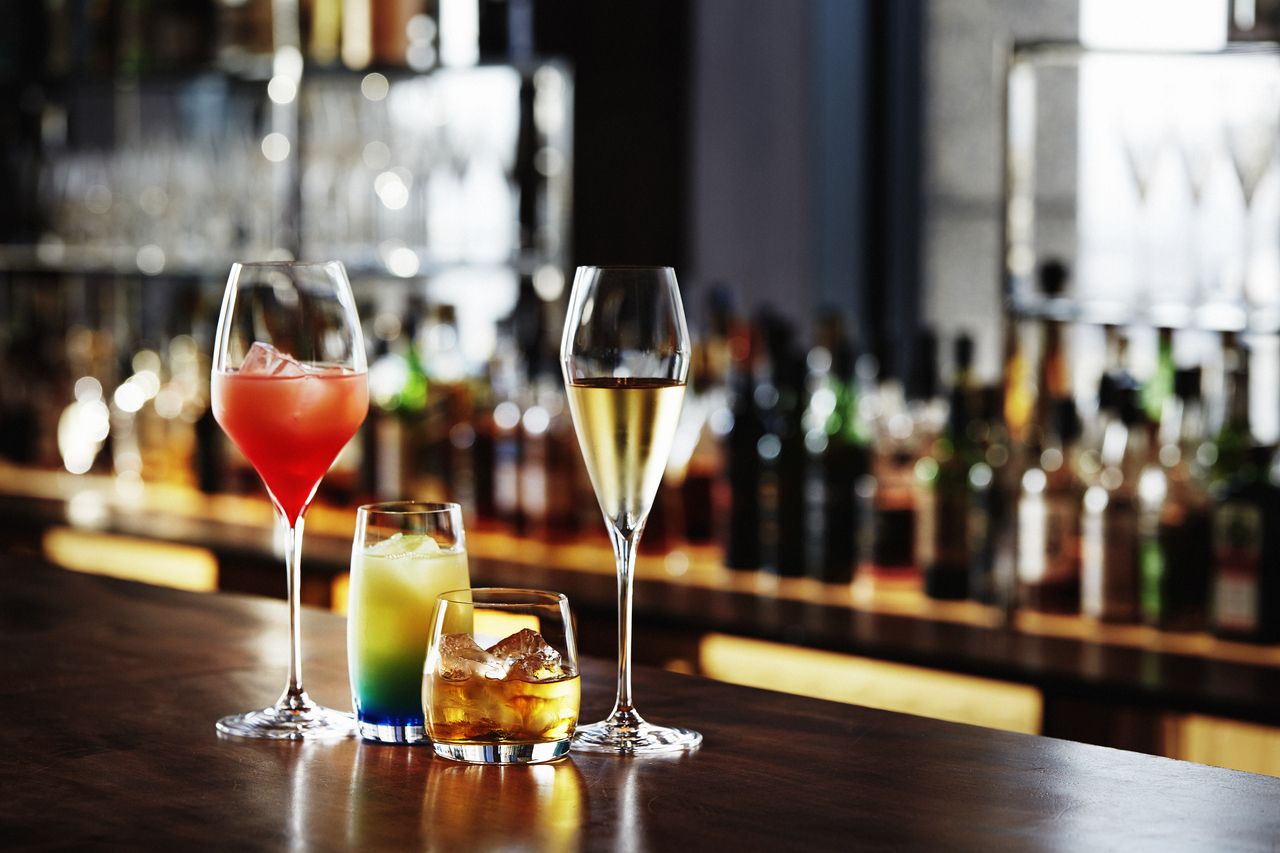 A glass of sparkling wine with appetizers and 16 free-flowing drinks